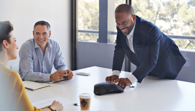 Business professional leading a meeting on a conference call.